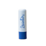 Dzintars Kolka Moisturising Lip Balm stick – white tube with navy blue base and Dzintars script logo, white background